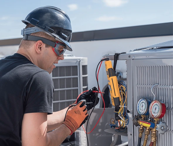 Technician repairing a heat pump, showcasing efficient and professional HVAC service.